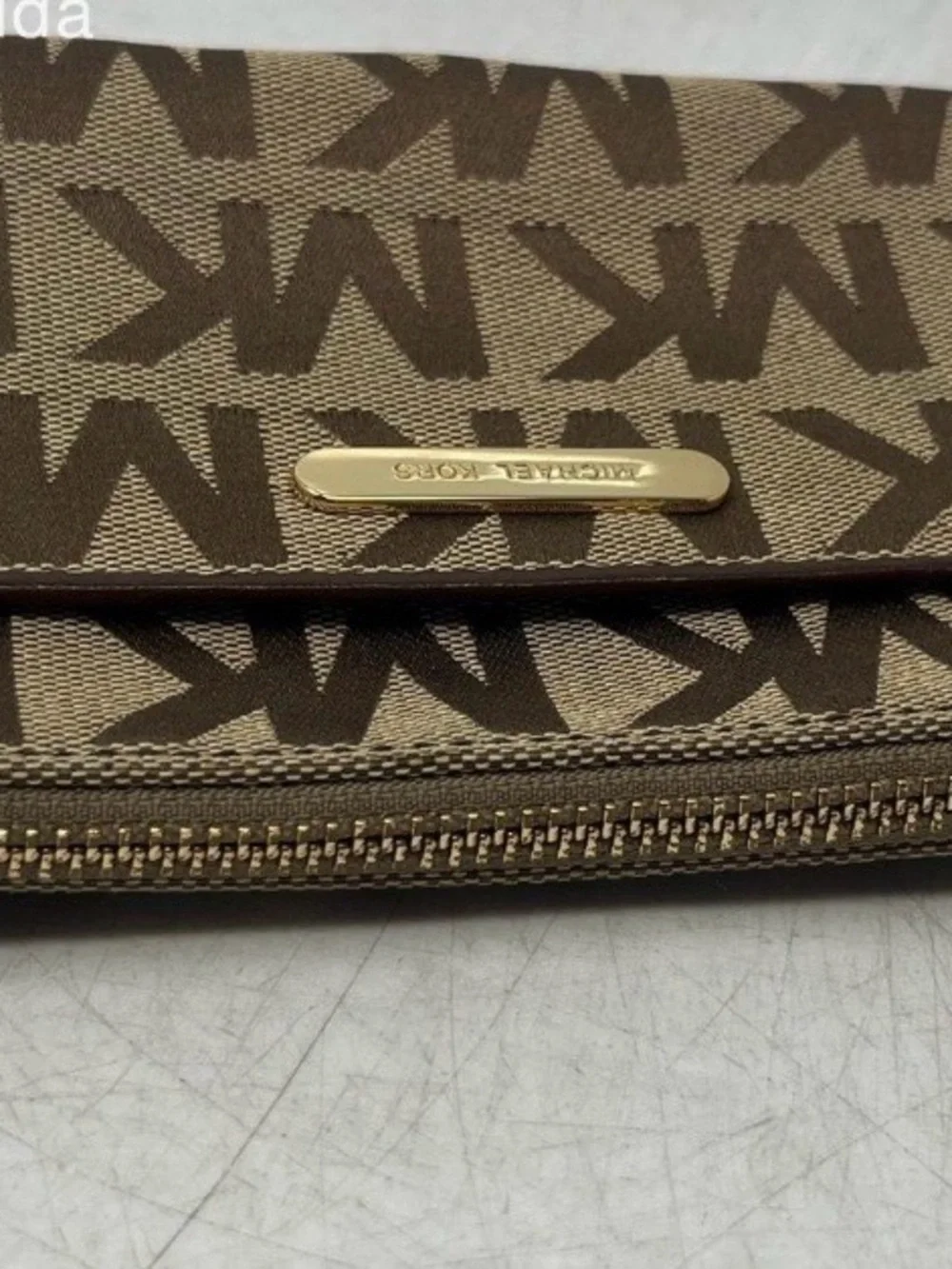 Michael Kors Brown and Tan Signature MK Wristlet with Gold Plate